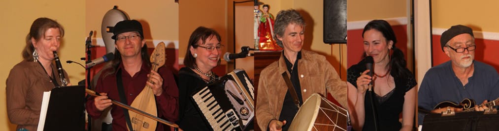 Members of the Balkan music group Barbelfish pictured with instruments and singing